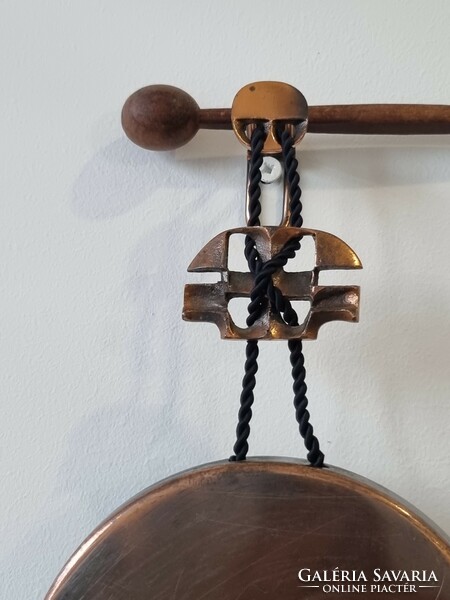 Old copper/tinted applied art gong/wall decoration with wooden beater