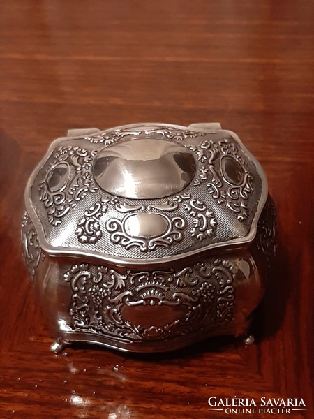 Beautiful richly patterned silver-plated jewelry box with plush lining inside