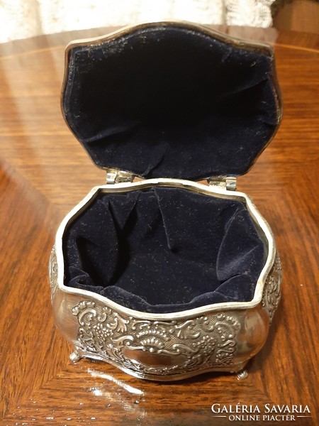 Beautiful richly patterned silver-plated jewelry box with plush lining inside