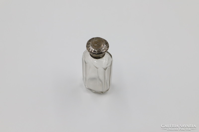 Perfume bottle with silver cap