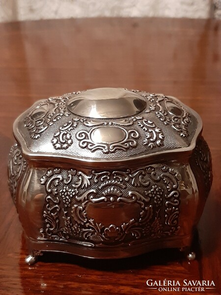 Beautiful richly patterned silver-plated jewelry box with plush lining inside