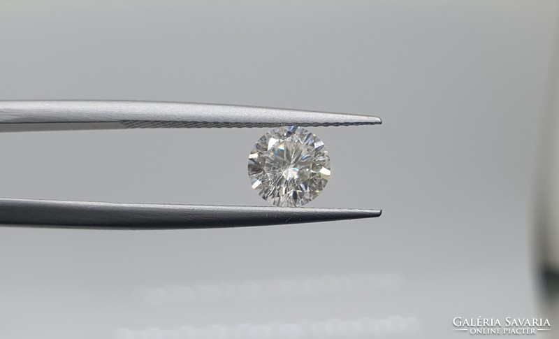 0.95 carat brill cut moissanite. With certification.