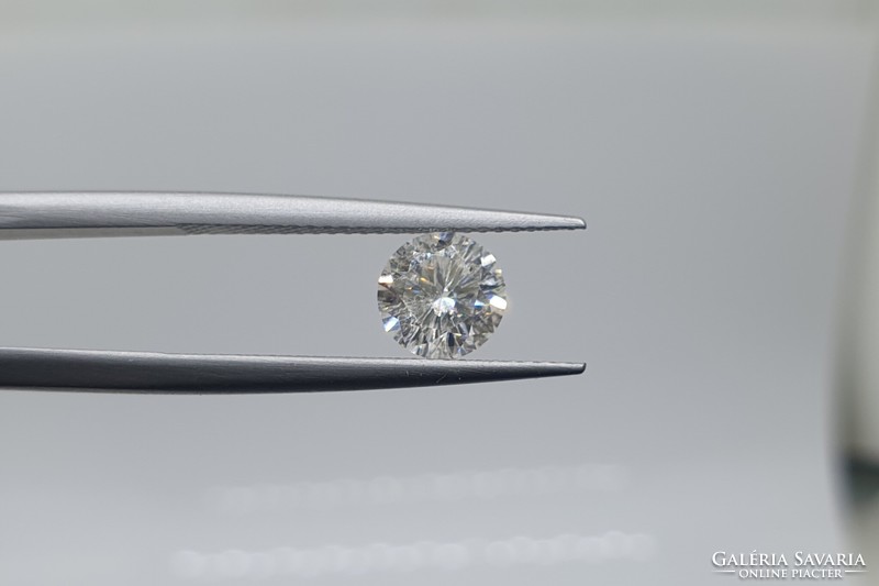 0.95 carat brill cut moissanite. With certification.