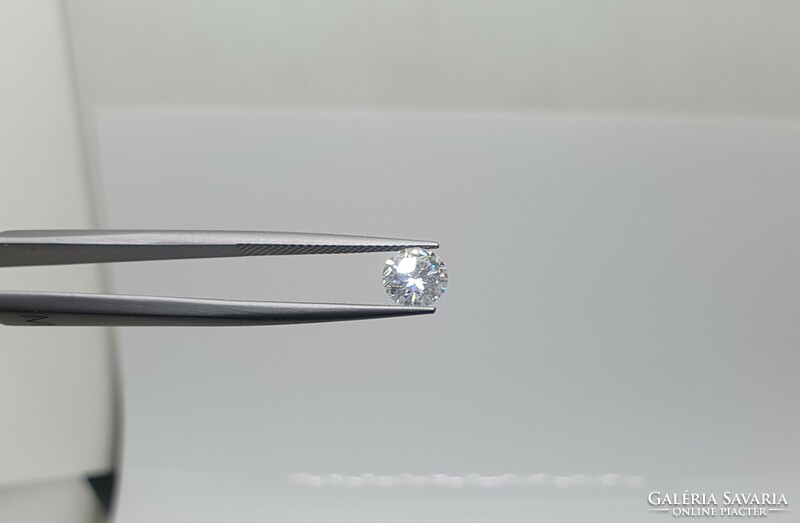 0.90 carat brill cut moissanite. With certification.