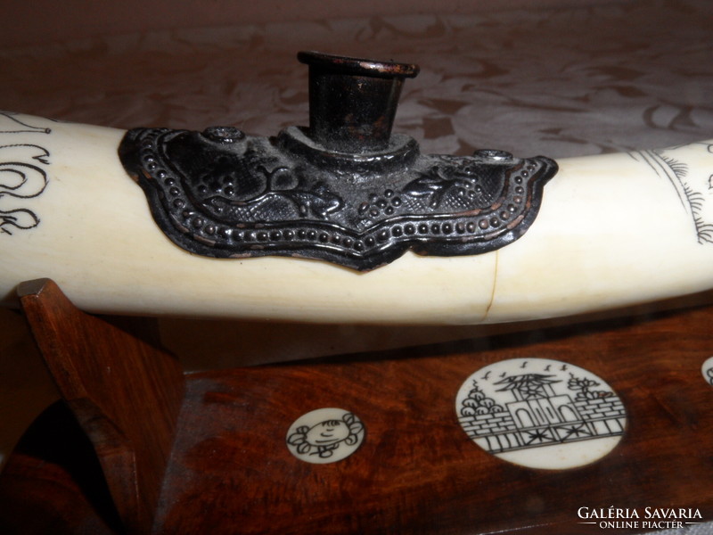 Far Eastern hand-painted, bone opium pipe on a wooden stand