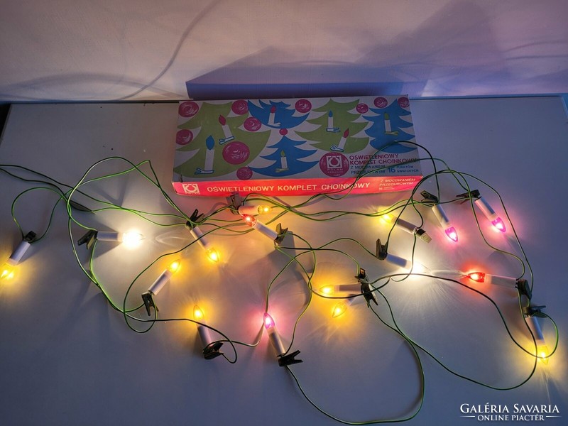 Old Christmas string of retro light bulbs with clip-on candles Christmas tree in a box