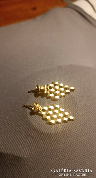Gold earrings in art deco style,