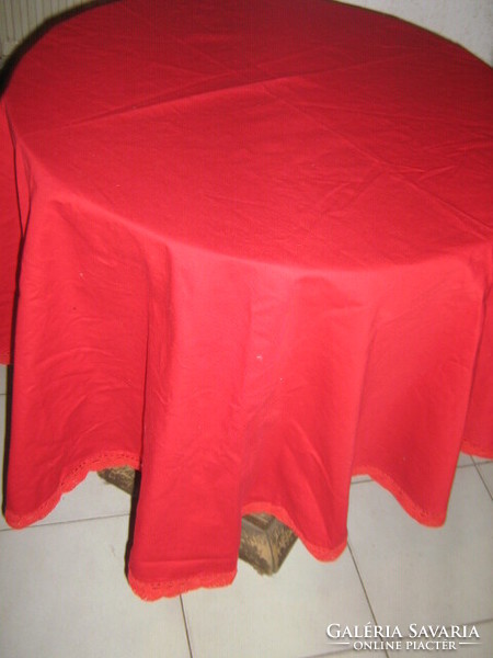 Beautiful red handmade round tablecloth with crochet edge