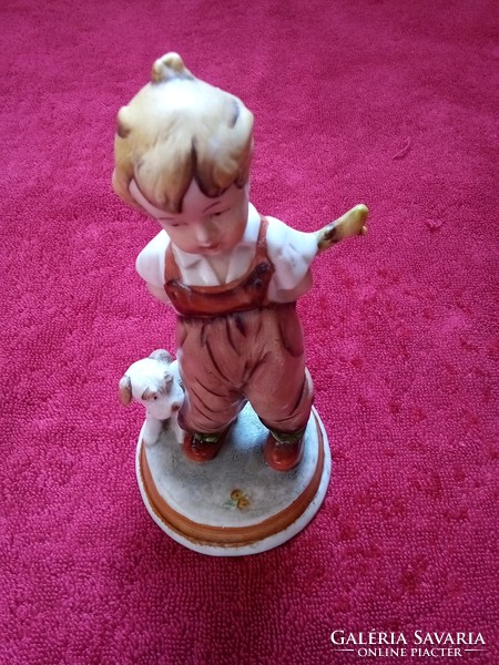 German porcelain boy nip with a dog