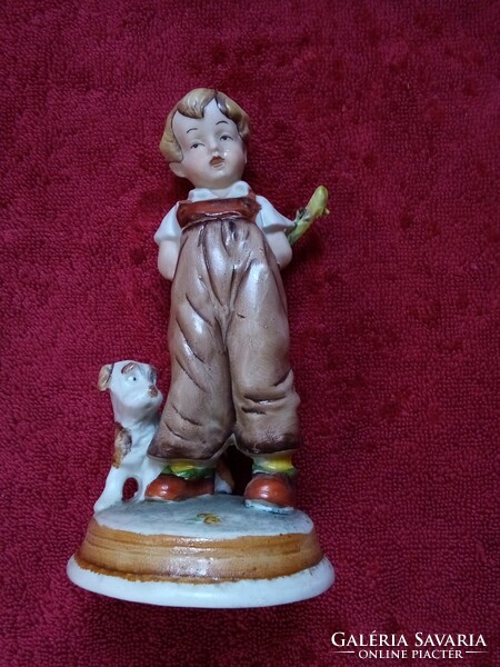 German porcelain boy nip with a dog