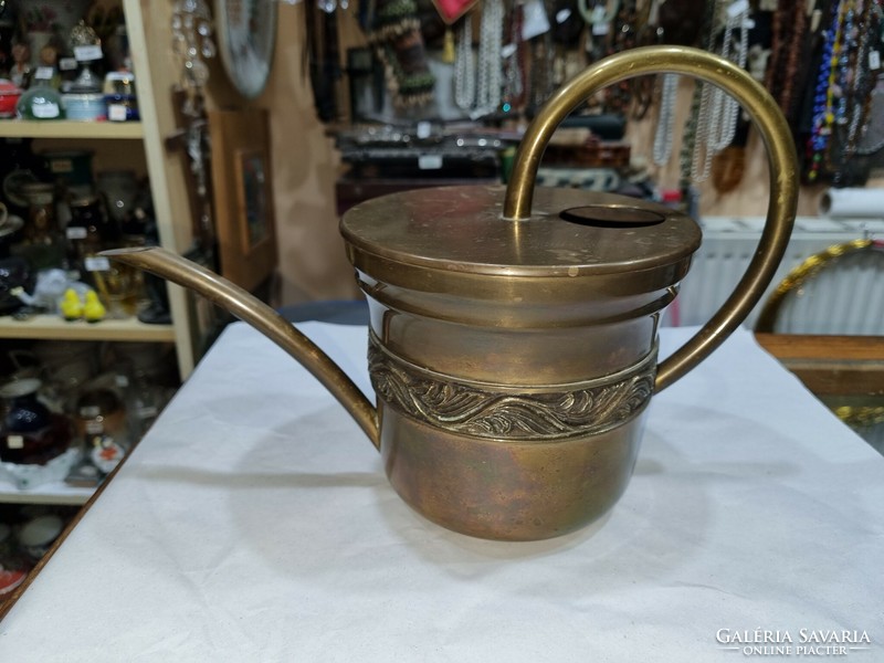 Old copper watering can