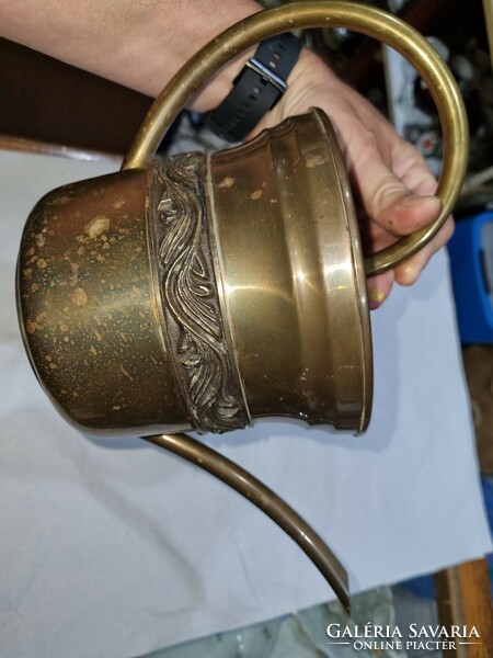 Old copper watering can