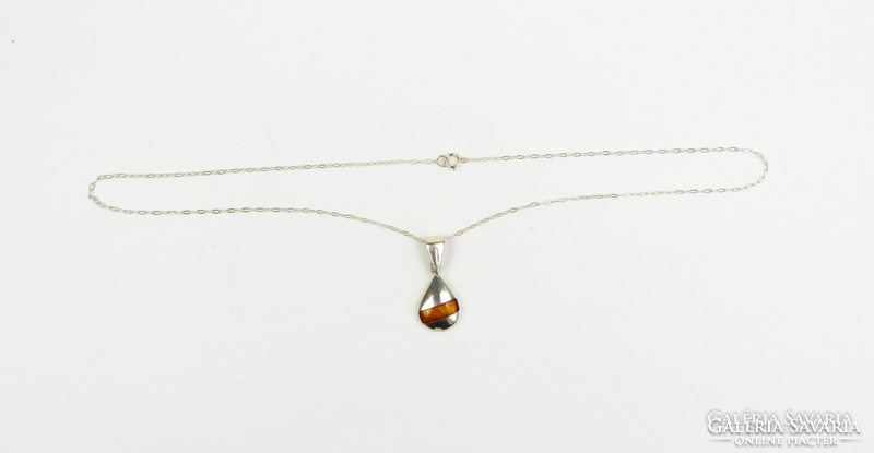 Silver necklaces with amber inlay