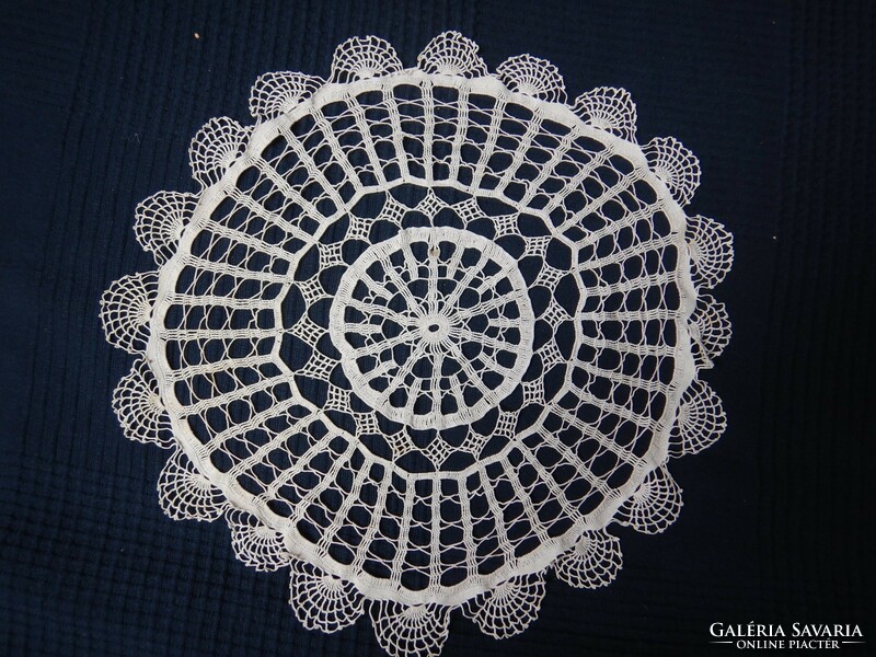 Five small crochet lace tablecloths in one