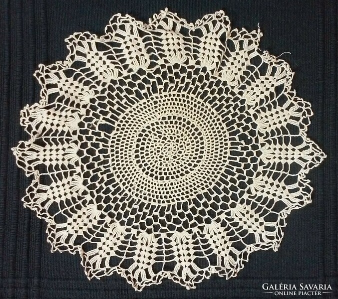 Five small crochet lace tablecloths in one