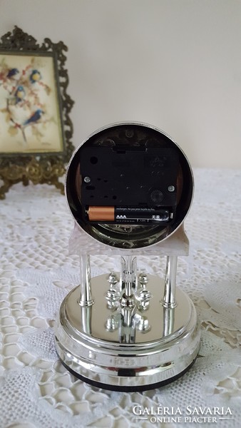 Small silver table clock with pendulum