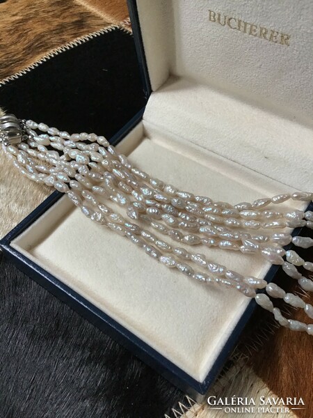 4-row string of river pearls with a modern silver clasp