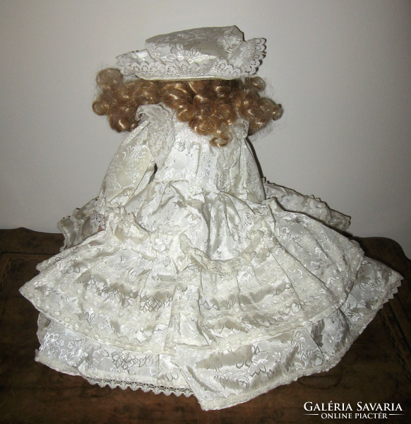 Charming porcelain head doll with pillow bottom