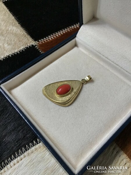 Old vintage gilded pendant with precious coral stone
