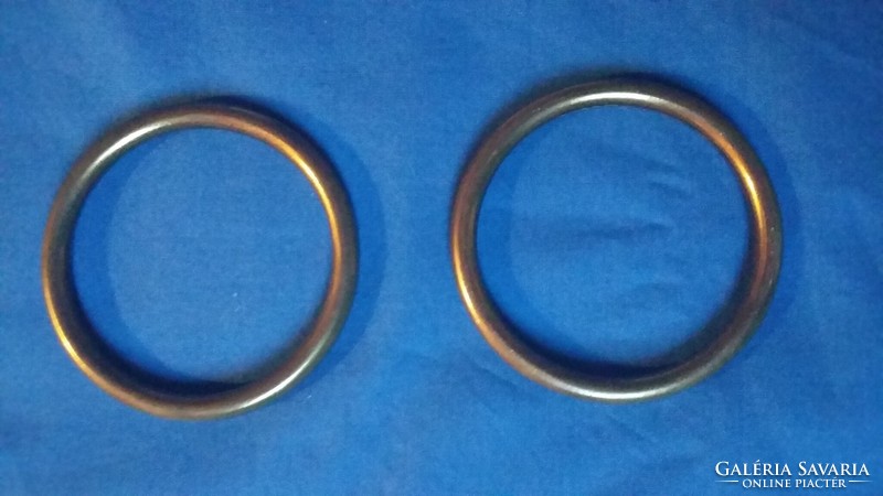 Two large closed metal rings