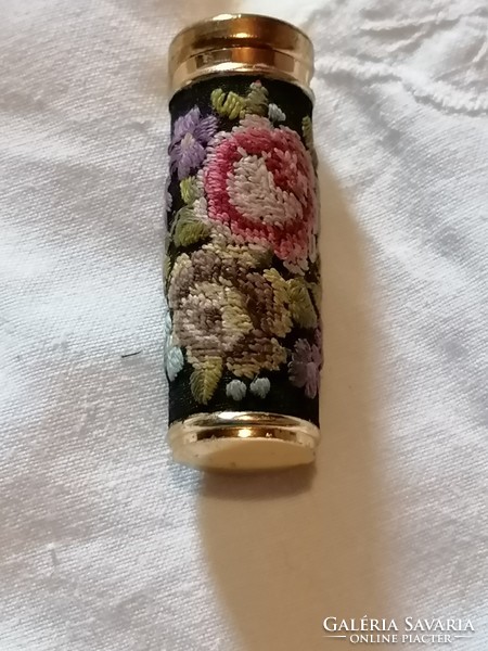 An embroidered lipstick holder from a bygone era