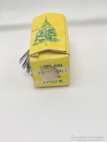 Old retfo Christmas tree decoration in foil garland box