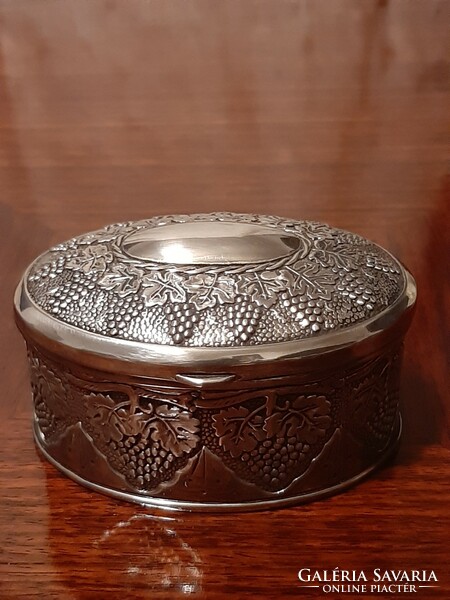 Beautiful richly decorated, oval silver-plated jewelry box with plush lining inside