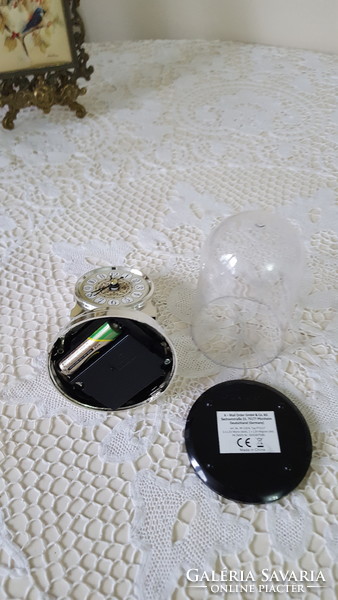 Small silver table clock with pendulum