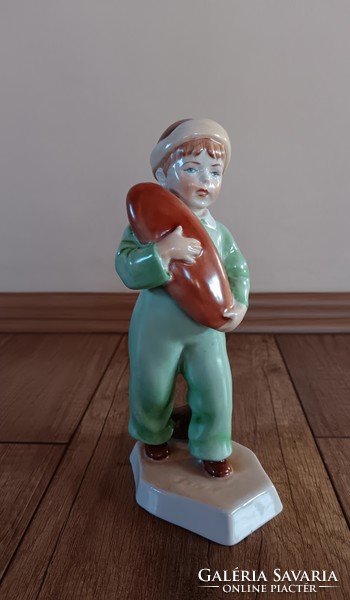 A rare Zsolnay figure in green clothes