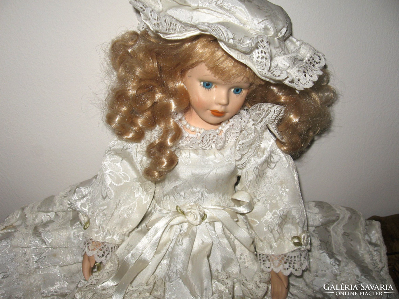 Charming porcelain head doll with pillow bottom