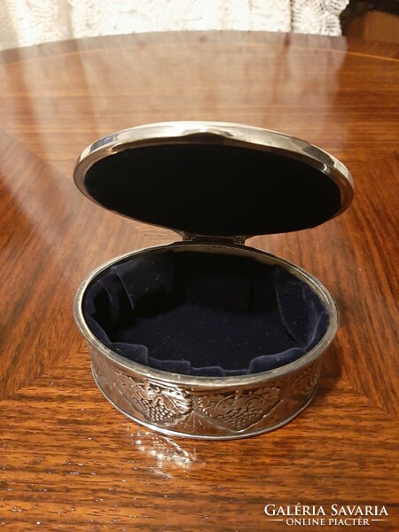 Beautiful richly decorated, oval silver-plated jewelry box with plush lining inside