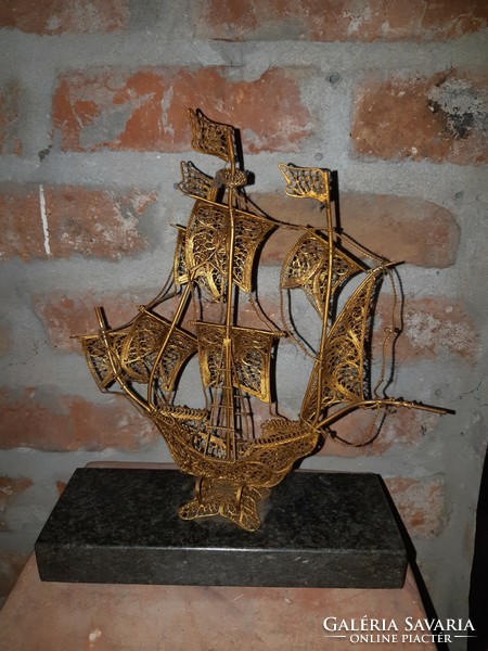 Vintage gold tone metal filigree sailboat