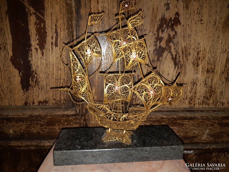 Vintage gold tone metal filigree sailboat