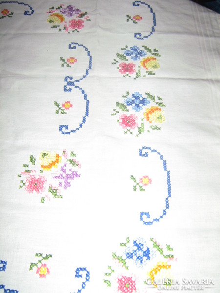 Hand-embroidered filigree tablecloth with beautiful floral cross stitches