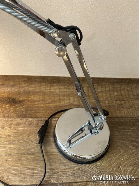 Adjustable chrome table lamp.