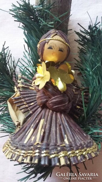 Old angelic Christmas ornament made of artificial and natural material