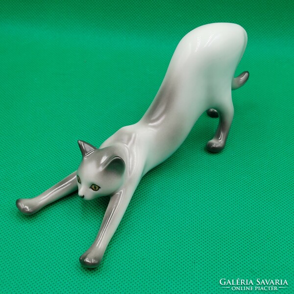 Stretching cat figurine from Raven House