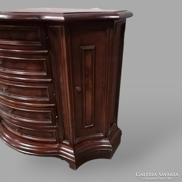 Curved chest of drawers with root veneer