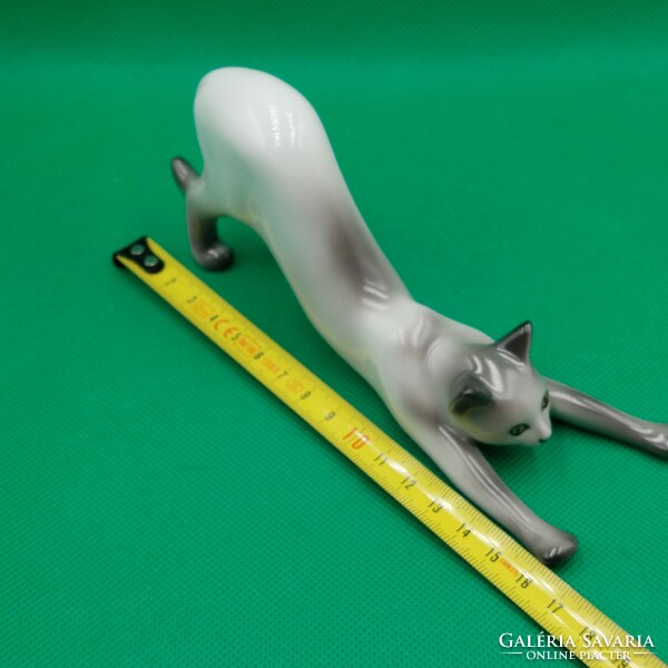 Stretching cat figurine from Raven House