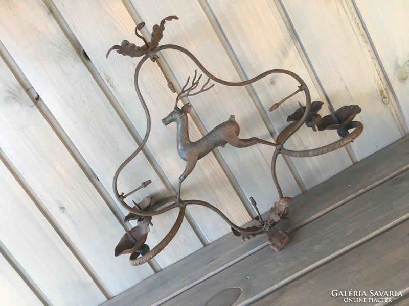 Hanging old iron candle holder with deer
