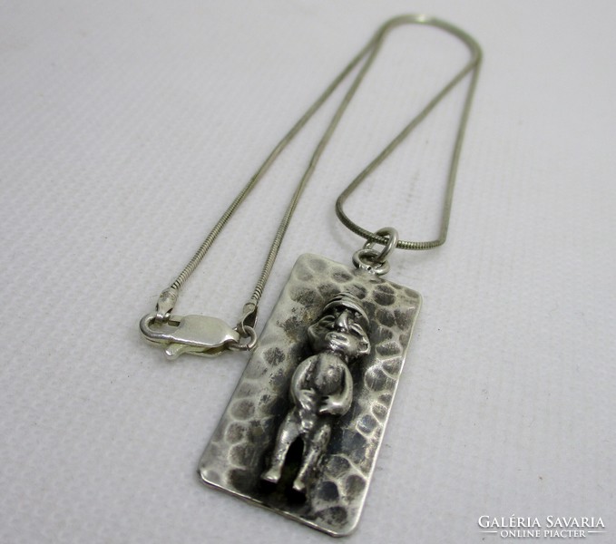 Special old handmade Mayan silver pendant on a silver necklace