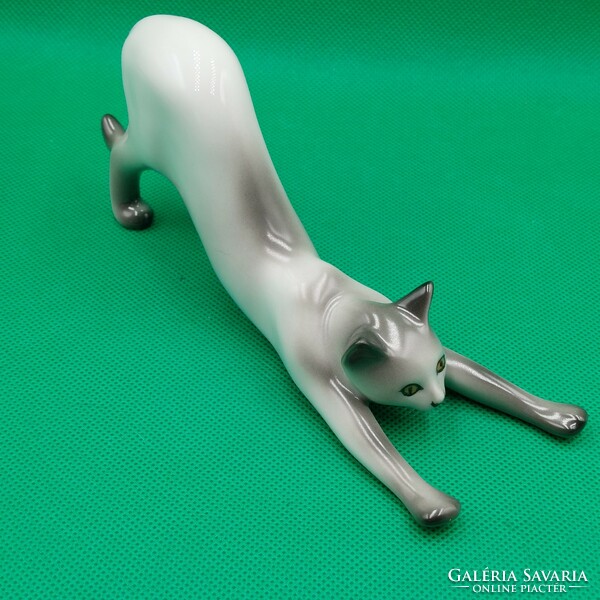 Stretching cat figurine from Raven House