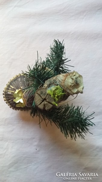 Old angelic Christmas ornament made of artificial and natural material