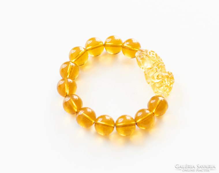 Chinese lucky bracelet made of glass beads - with a lion figure - amber color