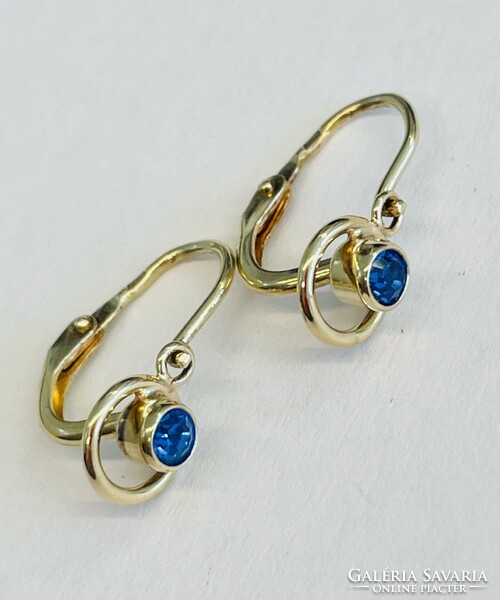 Gold baby earrings with blue stones