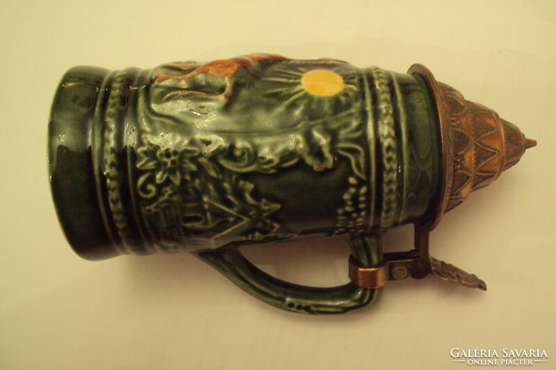 German, green-glazed, plastic-surfaced ceramic beer mug with an openable patterned red copper lid.