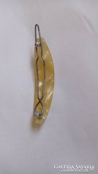 Old vinyl? Cellulose? Hair clip