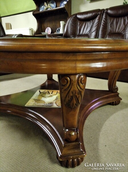 Colonial style coffee table with a large glass top, manufactured by American ashley.