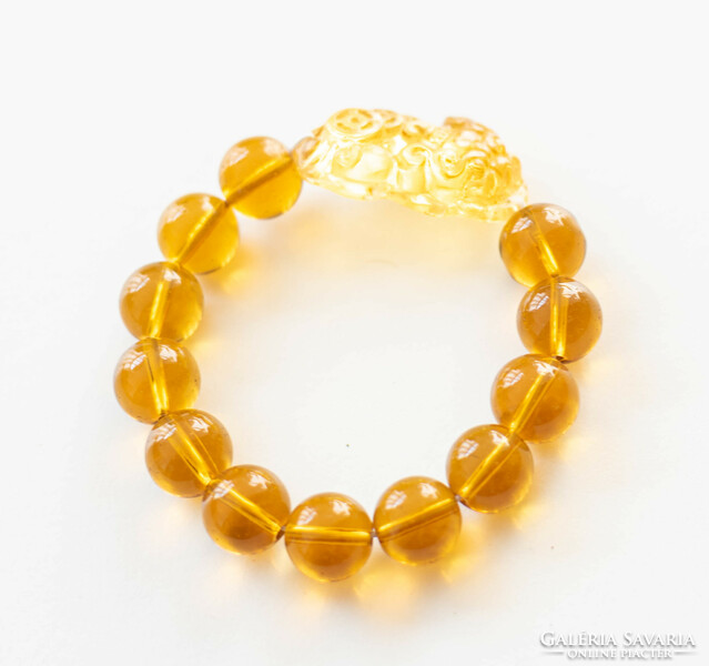 Chinese lucky bracelet made of glass beads - with a lion figure - amber color