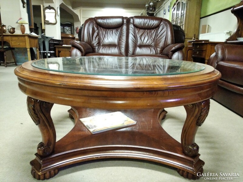 Colonial style coffee table with a large glass top, manufactured by American ashley.